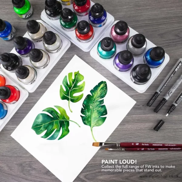 A promotional image for Daler Rowney FW Acrylic Inks. A birds eye view of a number of inks on a surface with a piece of paper that has a drawing of some green leaves. There are some paint brushes and markers around the inks. There are 20 different coloured ink bottles in the frame.