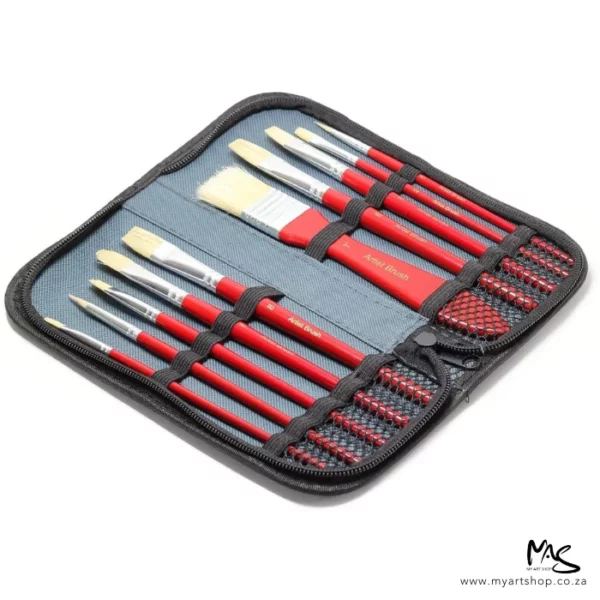 An open Daler Rowney Simply Oil White Bristle Brush Set in Zip Case is shown at a slight angle in the center of the frame. The case is grey with a black zip and the brushes have red handles and white hogs hair bristles. Each paint brush is held in place with a small piece of elastic. The image is center of the frame and on a white background.