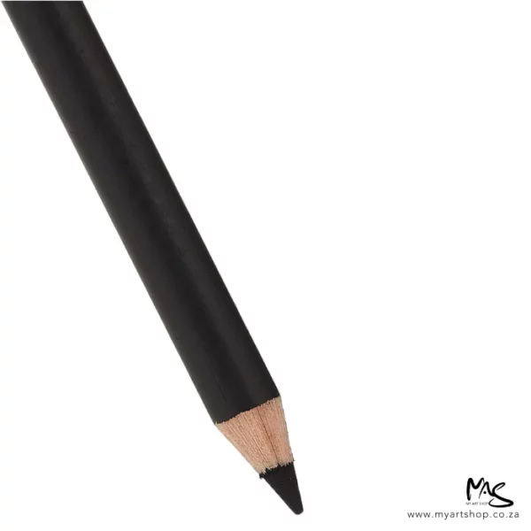 A close up of the tip and front end of a General's Carbon Sketch Pencil. The pencil is seen coming out of the top left hand corner of the frame. The black lead tip is facing the bottom of the frame. The pencil has a black barrel. On a white background.