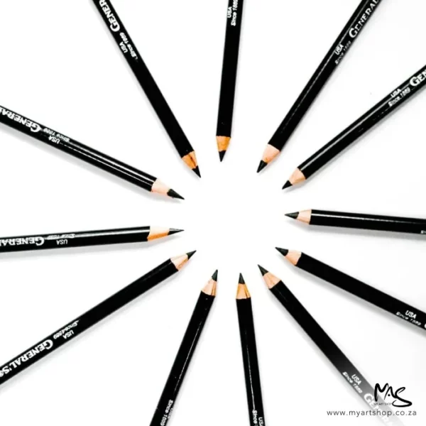 There are 12 pencils forming a circle shape in the center of the frame. The pencils are General's Layout Extra Black Pencil 555 and the lead tips are facing the center of the frame to form the circle. The pencils have a black barrel with text on the barrel. The image is center of the frame and on a white background. The image is cut off by the frame.