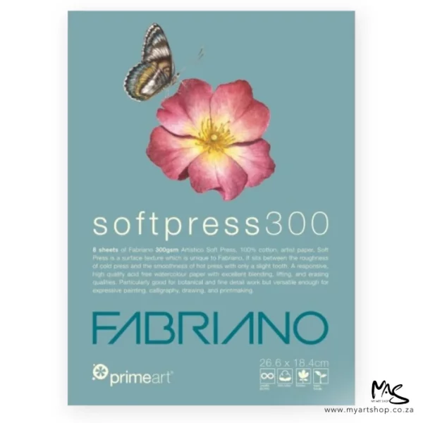 A Medium Prime Art Fabriano Soft Press Pad is shown in the center of the frame. The image is of the pad cover. The pad has a dusty blue cover with a picture of a pink flower and a butterfly on the cover. There is white and blue text below the image that describes the quality of the pad and has the brand name. The image is center of the frame and on a white background.