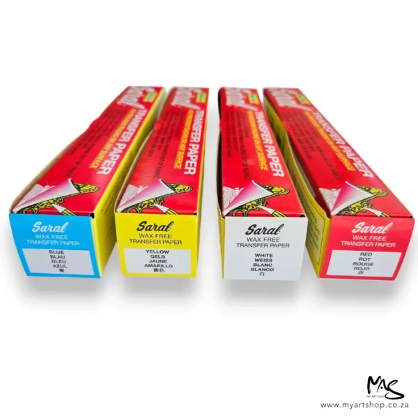 Four boxes of Saral Wax Free Transfer Paper Rolls are shown in the center of the frame. The box ends are facing the front of the frame and get smaller towards the back of the frame. Each box is thin rectangular and the colour of the paper inside is indicating on the end of each box.