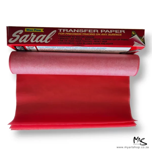 A long rectangular box is shown at an angle behind a roll of Saral Wax Free Transfer Paper Roll Red. The transfer roll is slightly unwound and is blue on white side and white on the other. The image is center of the frame and on a white background.