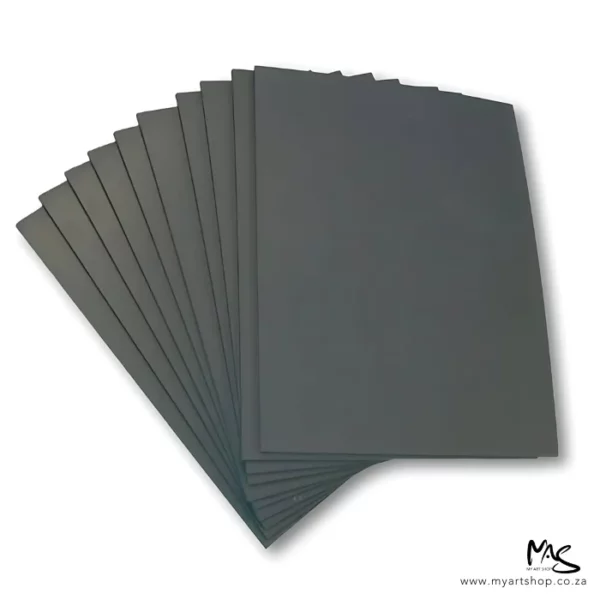 There are 10 Prime Art Soft Cut Lino Sheets shown, fanned out in the center of the frame. The lino is grey in colour and they are A4 sheets. On a white background.