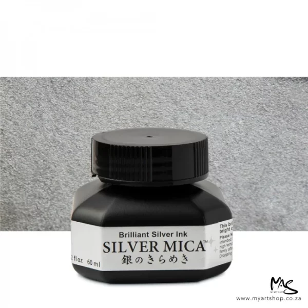 A single bottle of Silver Kuretake Mica Ink can be seen in the center of the frame. The bottle is frosted plastic and has a black plastic screw on lid. There is a label around the body of the bottle with the product name. You can see the coloured ink through the bottle. The image is on a white background and there is a metallic rectangle behind the bottle that reflects the colour of the ink.