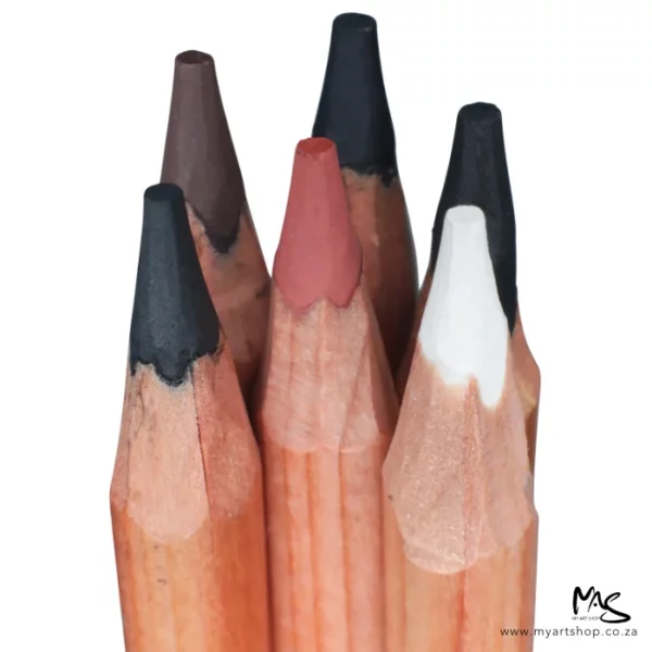 6 loose pencils from the Mont Marte Signature Coloured Charcoal Pencil Set are shown in the frame. It is a close up of the charcoal tips of the pencils. You can see a small amount of the wooden barrels. The charcoal tips are white, black and sepia in colour. The tips are pointing towards the top of the frame. On a white background.