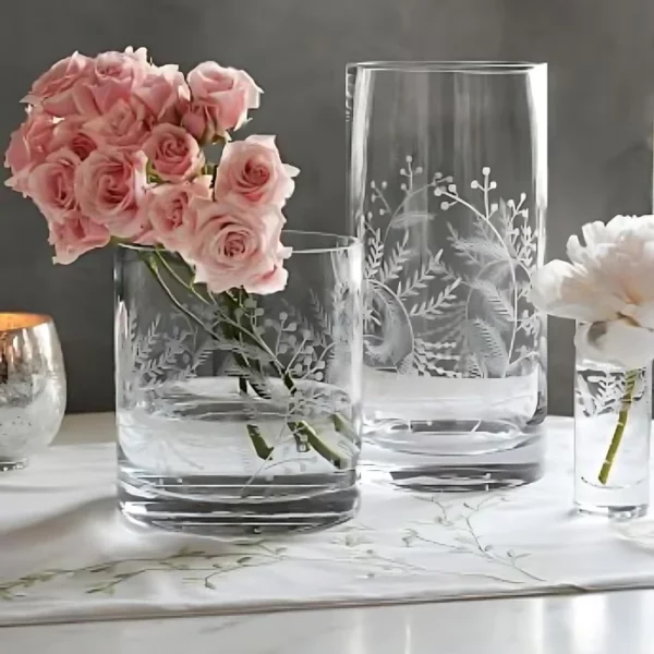 Some glas vases are shown in the frame, one with roses in it and designs are etched onto the glass using the Artboard Glass Etching Paste 100ml.