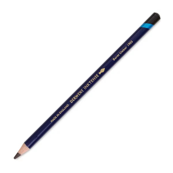 A single Burnt Umber Derwent Inktense Colour Pencil is shown diagonally across the center of the frame. The pencil is pointing with it's lead facing towards the bottom left hand corner. The barrel of the pencil is blue and the end of the pencil is colour dipped to match the colour of the lead for easy identification. There is text down the barrel of the pencil with the colour name and brand name. On a white background.