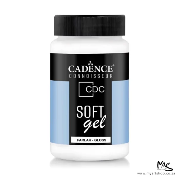 There is a single bottle of Cadence Connoisseur Soft Gel Gloss shown standing vertically in the center of the frame. The bottle is clear plastic and has a black screw on lid. There is a label around the body of the bottle that is coloured with blue and black and has text describing the contents of the bottle and has the brand name. The gel inside the bottle is white and can be seen through the clear plastic. The image is center of the frame and on a white background.