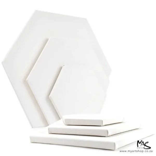 There are 6 Dala Hexagonal Stretched Canvases shown in the frame. Three of different sizes are standing up vertically along the left hand side of the frame and the remaining three (also different sizes), are laying down in front of the others. Only the top canvas part of the canvases can be seen. On a white background.