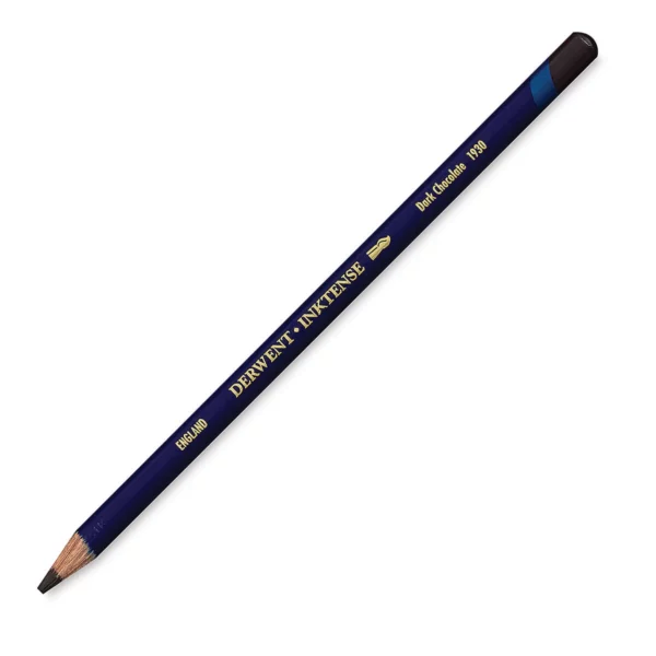 A single Dark Chocolate Derwent Inktense Colour Pencil is shown diagonally across the center of the frame. The pencil is pointing with it's lead facing towards the bottom left hand corner. The barrel of the pencil is blue and the end of the pencil is colour dipped to match the colour of the lead for easy identification. There is text down the barrel of the pencil with the colour name and brand name. On a white background.