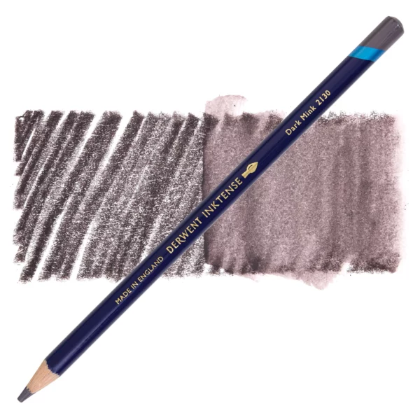 A single Dark Mink Derwent Inktense Colour Pencil is shown diagonally across the center of the frame. The pencil is pointing with it's lead facing towards the bottom left hand corner. The barrel of the pencil is blue and the end of the pencil is colour dipped to match the colour of the lead for easy identification. There is text down the barrel of the pencil with the colour name and brand name. There is a colour swatch of the pencil in the background, that runs horizontally across the center of the frame. The image is center of the frame and on a white background.