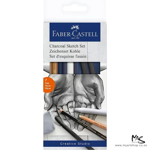 A Faber Castell Charcoal Sketch Set is shown standing vertically in the center of the frame. The set is in a cardboard box with a hang tab top. The box is white and has a picture of two hands opened out on the cover with some pencils shown over the hands. There is text at the top of the packaging. The image is center of the frame and on a white background.