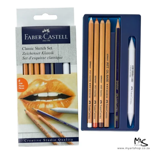 A Faber Castell Classic Sketch Set is shown standing vertically along the left hand side of the frame. The set is in a cardboard box with a hang tab top. The box is white and has a picture of a persons lips on the cover with some pencils shown over the hands. There is text at the top of the packaging. The contents of the set are shown in a blue plastic base to the right of the box and it is over lapping the box. There are 5 pencils and 1 paper stump. The image is center of the frame and on a white background.