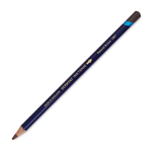 A single Natural Brown Derwent Inktense Colour Pencil is shown diagonally across the center of the frame. The pencil is pointing with it's lead facing towards the bottom left hand corner. The barrel of the pencil is blue and the end of the pencil is colour dipped to match the colour of the lead for easy identification. There is text down the barrel of the pencil with the colour name and brand name. On a white background.