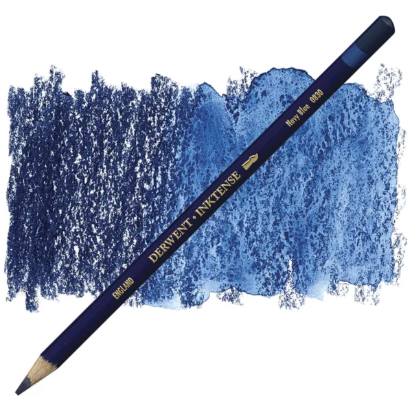 A single Navy Blue Derwent Inktense Colour Pencil is shown diagonally across the center of the frame. The pencil is pointing with it's lead facing towards the bottom left hand corner. The barrel of the pencil is blue and the end of the pencil is colour dipped to match the colour of the lead for easy identification. There is text down the barrel of the pencil with the colour name and brand name. There is a colour swatch of the pencil in the background, that runs horizontally across the center of the frame. The image is center of the frame and on a white background.