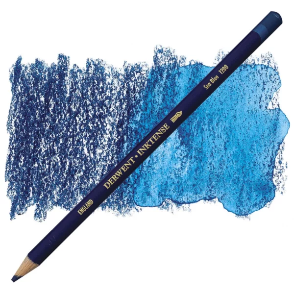 A single Sea Blue Derwent Inktense Colour Pencil is shown diagonally across the center of the frame. The pencil is pointing with it's lead facing towards the bottom left hand corner. The barrel of the pencil is blue and the end of the pencil is colour dipped to match the colour of the lead for easy identification. There is text down the barrel of the pencil with the colour name and brand name. There is a colour swatch of the pencil in the background, that runs horizontally across the center of the frame. The image is center of the frame and on a white background.