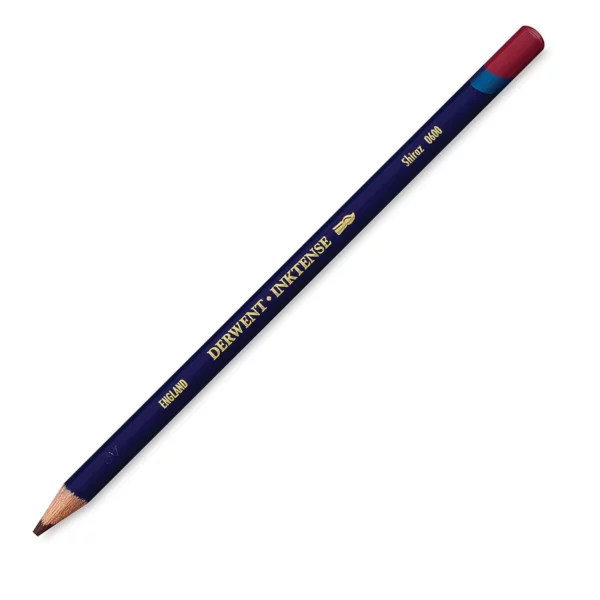 A single Shiraz Derwent Inktense Colour Pencil is shown diagonally across the center of the frame. The pencil is pointing with it's lead facing towards the bottom left hand corner. The barrel of the pencil is blue and the end of the pencil is colour dipped to match the colour of the lead for easy identification. There is text down the barrel of the pencil with the colour name and brand name. On a white background.