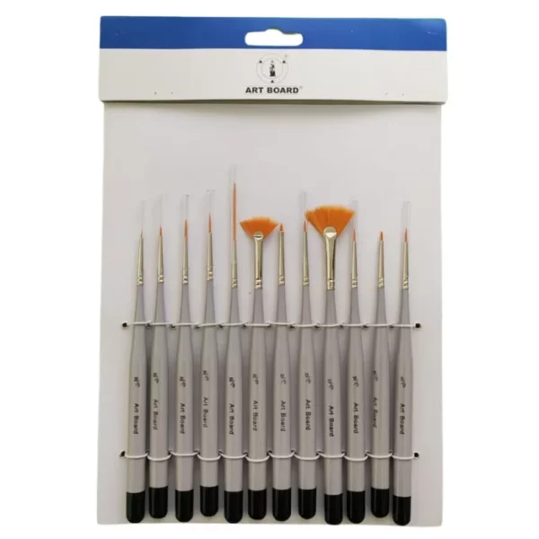 A single Artboard Detail Brush Set is shown in the center of the frame. The set is in a hang pack with a cardboard backing and a clear front. You can see the 12 brushes through the packaging. The brushes have a black dipped end and a silver handle with golden taklon bristles. The brushes are different sizes and different shapes. The image is center of the frame and on a white background.