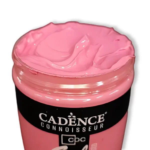 An open jar of Cadence Connoissuer Heavy Body Gel Acrylics can be seen at the bottom, middle of the frame. It is a pink gel paint and you can see the texture of the paint as the lid is off. On a white background.