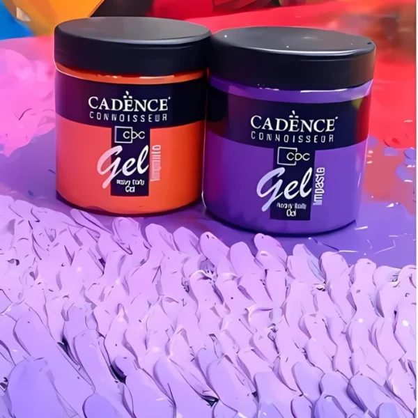 There are two tubs of Cadence Connoissuer Heavy Body Gel Acrylics at the back of the frame. One jar is holding orange paste and the jar on the right is holding purple paste. The jars are clear plastic and you can see the colour of the paint through the jar. The jars have a black, screw on plastic lid and a label around the body that has the Cadence logo printed on it, as well as the product name and details. The jars are laying on a project that was made using them. There are hundreds of peaks that were made using the gels and a palette knife. The peaks are different shades of purple. It is an impasto technique.