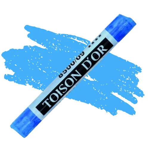 A single Cerulean Blue Koh-I-Noor Toison D’Or Soft Pastel is shown diagonally, across the center of the frame. The pastel has a paper wrapper around the body, which is printed in black with the brand name and product colour number. There is a colour swatch in the center of the background, behind the pastel, that indicates the colour of the pastel. On a white background.