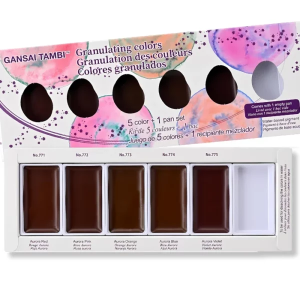 A Granulating Gansai Tambi Watercolour Set is shown in the frame. The box top is shown at the top of the frame and the base of the set, with the paint pans is shown at the bottom of the frame. The box cover is white with coloured, painted circles on it, and there are die cut holes in the lid so that you can see the colour of the paint pans inside. The paint pans are rectangular in shape and there are 5 paints and one empty paint pan. On a white background.