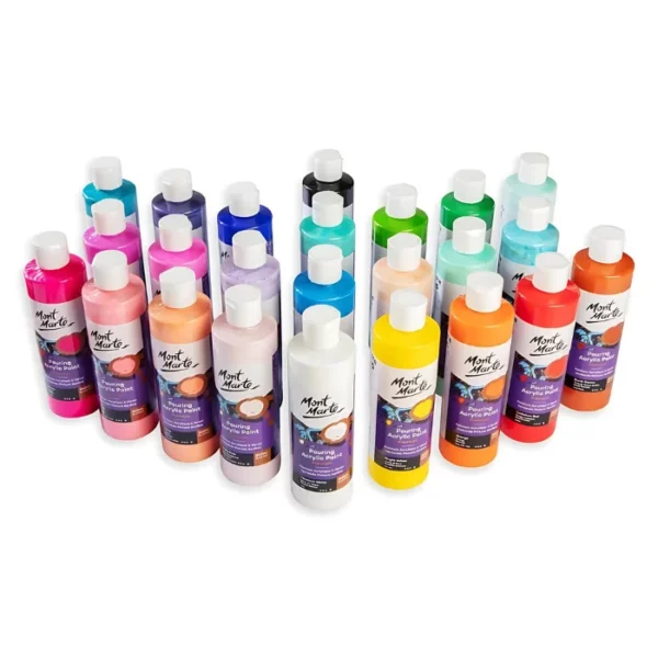 There are 24 different coloured bottles of Mont Marte Pouring Acrylic Paint shown standing in a V formation in the center of the frame horizontally. The bottles are clear plastic with a white plastic flip top. Each bottle has a printed label around the body of the bottle. On a white background.