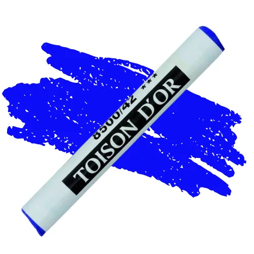 A single Ultramarine Blue Koh-I-Noor Toison D’Or Soft Pastel is shown diagonally, across the center of the frame. The pastel has a paper wrapper around the body, which is printed in black with the brand name and product colour number. There is a colour swatch in the center of the background, behind the pastel, that indicates the colour of the pastel. On a white background.