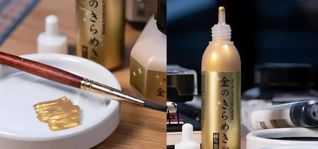 the left hand image is A close up of some Gold Kuretake Mica Paste that has been put in a white ceramic bowl. There is a paint brush leaning across the bowl. Parts of the paste bottle can be seen in the background. and the right hand image is A close up of a bottle of Gold Kuretake Mica Paste can be seen standing on a desk. The lid is off and set to the left of the bottle. The bottle is aligned more to the left hand side of the frame. The bottle is clear plastic with a gold label that has black chinese print on the label. There are other art supplies in the background. 