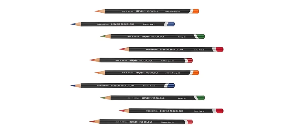 Derwent Procolour Pencils. 10 Procolour Pencils are laying horizontally across the center of the frame. The pencils are staggered one on top of each other with a gap between each pencil. The pencils have a black barrel and the ends of each pencil are coloured to match the colour of the pencils leads. The image is on a white background.