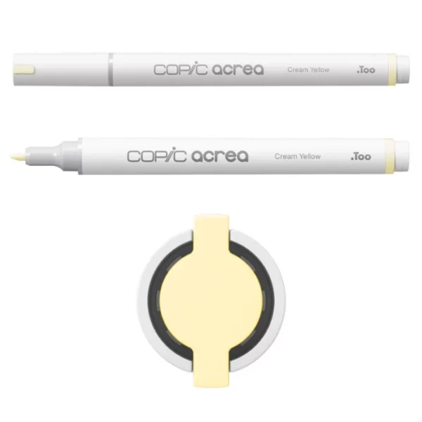 Two Cream Yellow Copic Acrea Paint Markers are shown, laying horizontally, one below the other, at the top of the frame. The marker at the top has a lid on and the marker below it has no lid. The markers are white and have a colour band around the base of the barrel that denotes the colour of the ink. The Copic Acrea logo is printed on the barrel of the marker with the colour name. The top of a lid can be seen in the center, bottom of the frame. There is a coloured circle on the cap that denotes the colour of the ink. The image is center of the frame and on a white background.