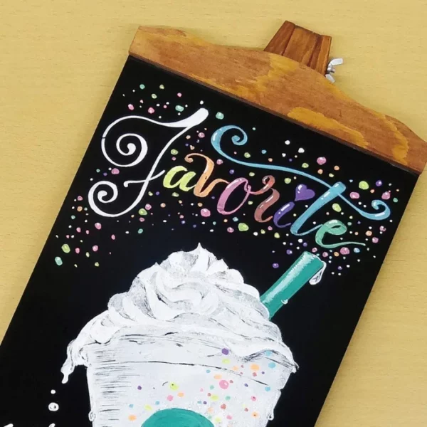 A picture of an ice cream has been drawn on a small chalkboard, using the Zig Posterman Wet Wipe Paint Marker Medium Set of 8.