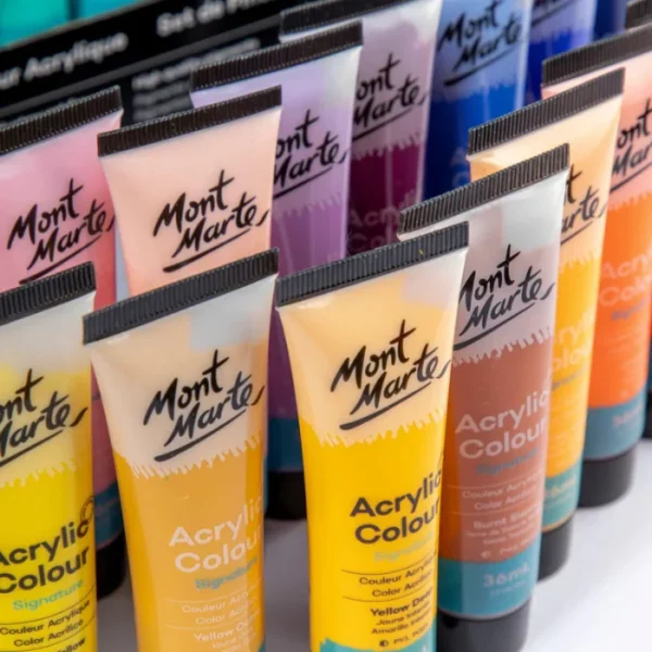 The frame is filled with a close up of individual tubes of paint from the Mont Marte Signature Acrylic Paint Set 48 Piece. They are cut off by the frame.