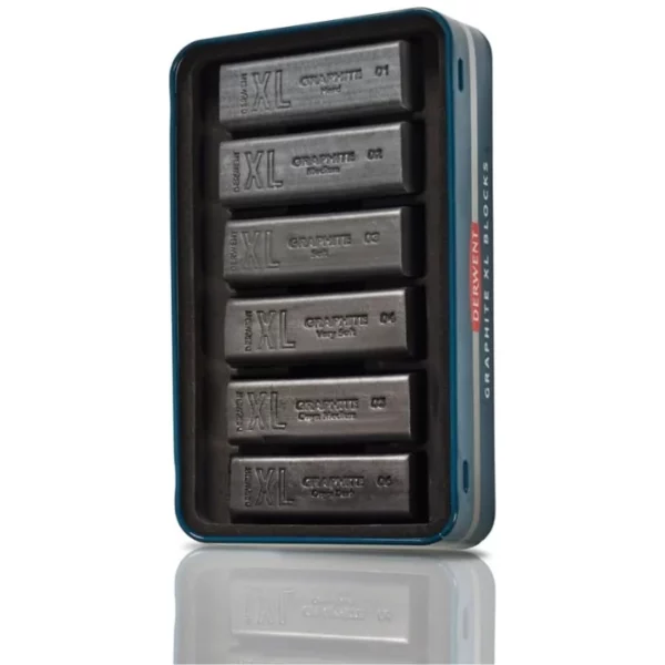 The bottom tray of a Set of 6 Derwent Graphite XL Blocks is shown vertically in the center of the frame. There are 6 XL sticks in the tray and are held in place with a black, molded plastic piece. On a white background.