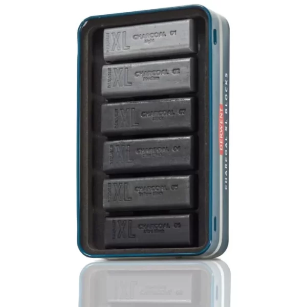 The bottom tray of a Set of 6 Derwent Charcoal XL Blocks is shown vertically in the center of the frame. There are 6 XL sticks in the tray and are held in place with a black, molded plastic piece. On a white background.